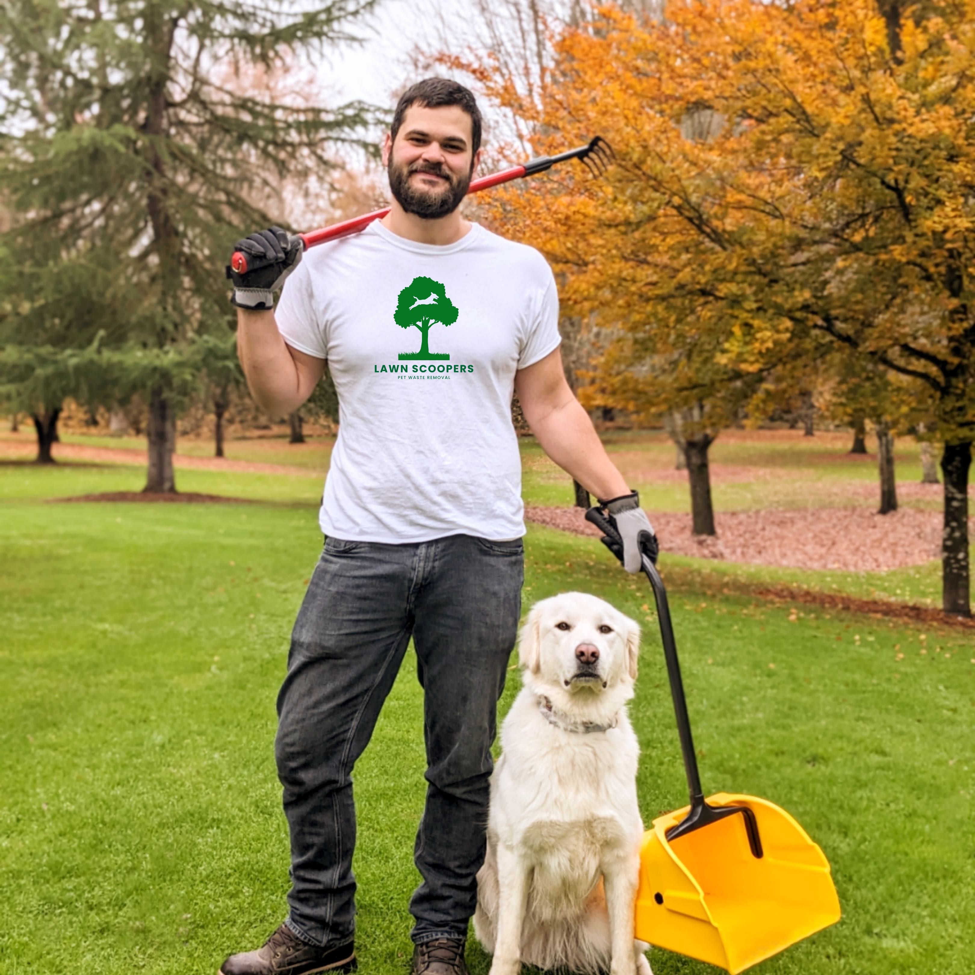 Professional dog waste removal service - Lawn Scoopers owner with equipment and friendly dog in a beautiful park setting